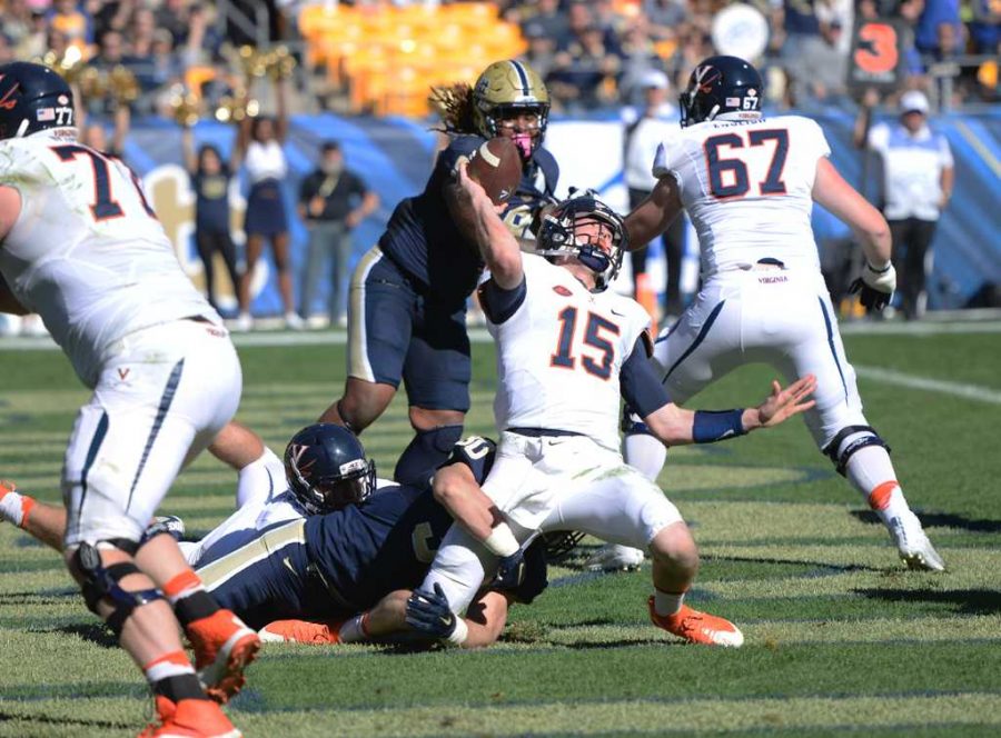 Virginia quarterback Matt Johns struggles to get a pass out thanks to Pitt's defense. Jeff Ahearn | Assistant Visual Editor