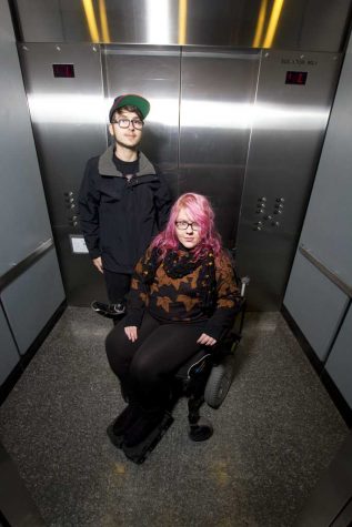 Monica Silny and her aide, Blake Hubert, in the elevator she uses to get to her dorm from the Petersen Events Center. Theo Schwarz | Senior Staff Photographer