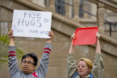About 15 students offered "free hugs" outside the Cathedral. Kyleen Considine | Staff Photographer