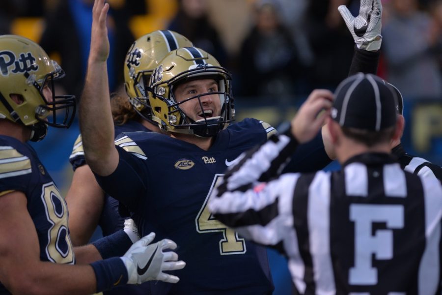 Pitt QB Nathan Peterman signals for a touchdown after a 43-yard run. Referees initially ruled the play a touchdown, then ruled Peterman out of bounds at the 1-yard line after a review. Steve Rotstein | Contributing Editor