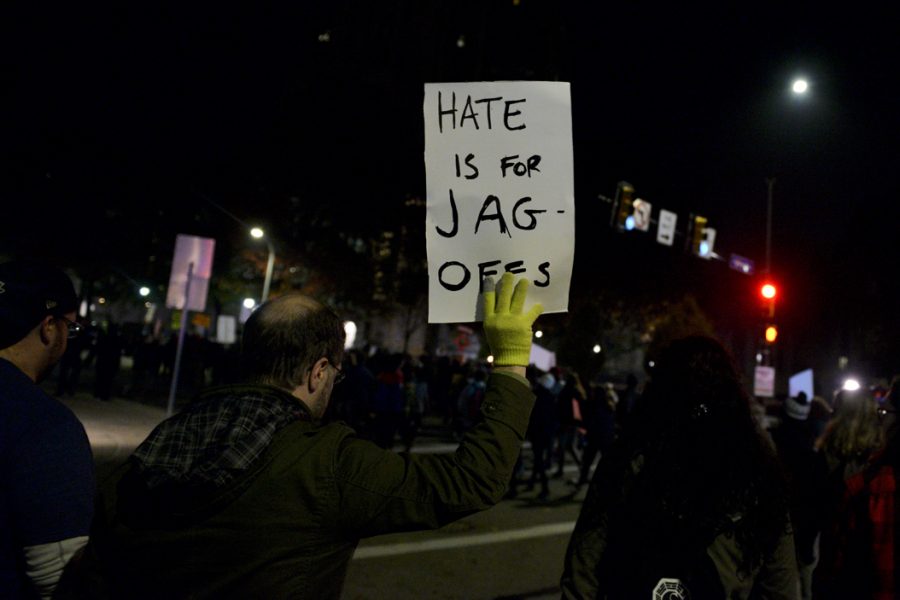 Justin Goff, of Mt. Lebanon, participated in his first protest Wednesday night. On his sign, Goff said "it was my wife's idea, I can't take credit." Stephen Caruso | Online Visual Editor