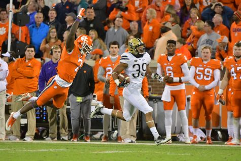 First-year linebacker Saleem Brightwell returns an interception 70 yards in the fourth quarter of the Panthers' 43-42 win against Clemson. Mike Williams (7) made a shoestring tackle to prevent a touchdown. Courtesy of Pete Madia/Pitt Athletics