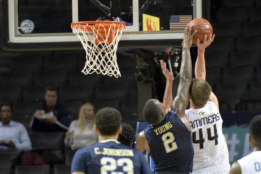 Pitt senior forward Michael Young (2) makes an emphatic block on Georgia Tech center Ben Lammers in the first half of the Panthers' 61-59 win. John Hamilton | Visual Editor