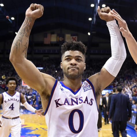 Kansas point guard Frank Mason (0) celebrates with teammate Mitch Lightfoot, right, after a 73-68 win against Baylor on Wednesday, Feb. 1, 2017, at Allen Fieldhouse in Lawrence, Kansas. (Rich Sugg/Kansas City Star/TNS)