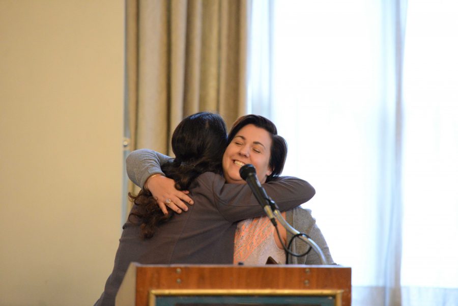 Abby+Yochum+hugs+Sara+Goodkind+as+she+accepts+the+Iris+Marion+Young+Award+for+Political+Engagement.
