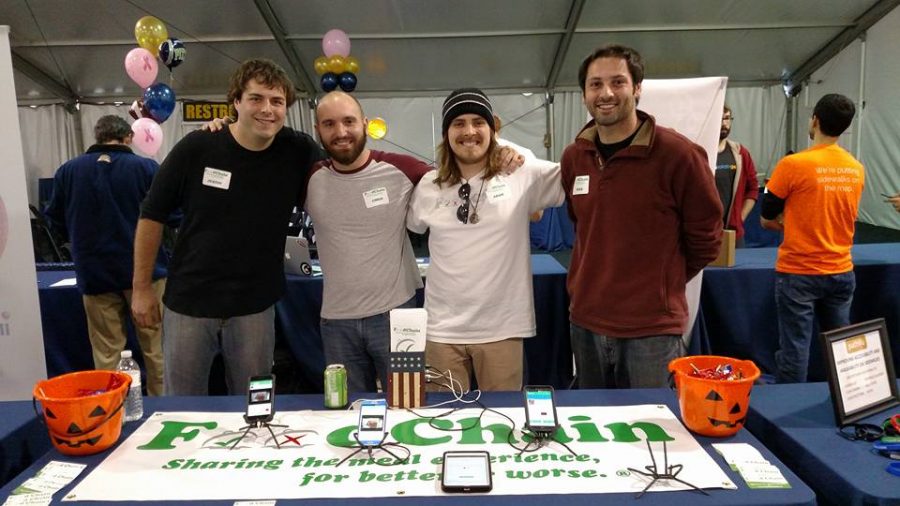 FoodChain cofounders advertising their app at a Pitt event. Photo courtesy of FoodChain.