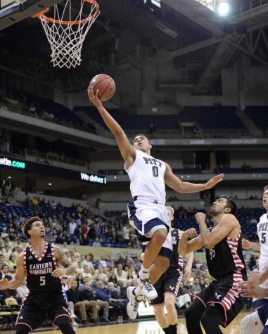 James Robinson soars for a layup. Wenhao Wu | Staff Photographer