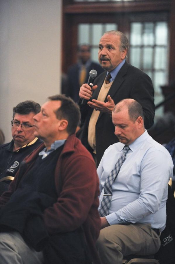 An attendee asks a question at the Town Hall Meeting hosted by Pitt Athletics Director Scott Barnes in Alumni Hall Tuesday night.  Jordan Mondell | Staff Photographer  