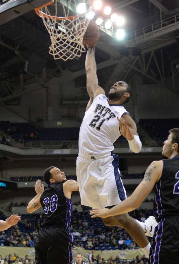 Sheldon Jeter launches in the air for a massive dunk.  Jeff Ahearn | Senior Staff Photographer