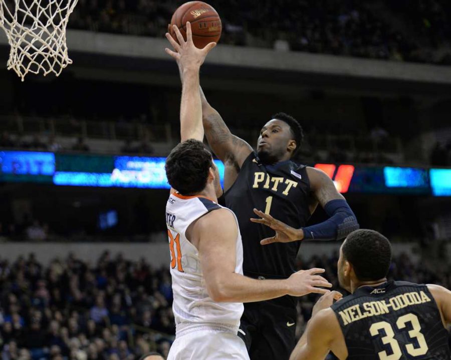 Jamel Artis attempts a layup against a Virginia defender. Jeff Ahearn | Assistant Visual Editor