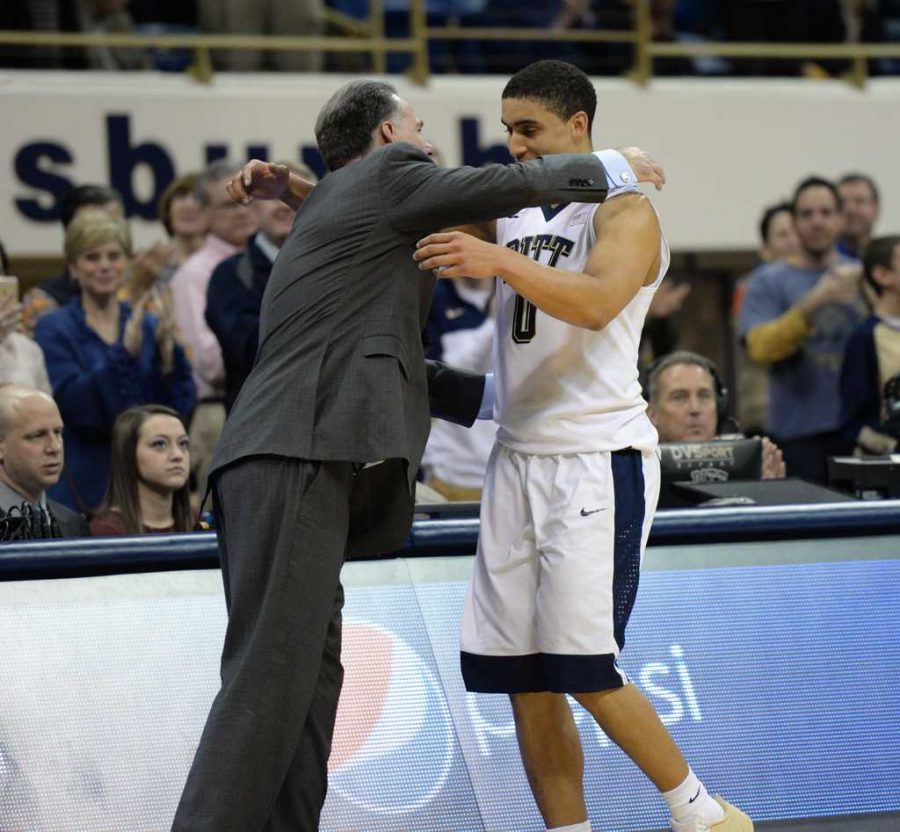 Coach Dixon hugs James Robinson as he walks off the court for his last time at home.  Jeff Ahearn | Assistant Visual Editor
