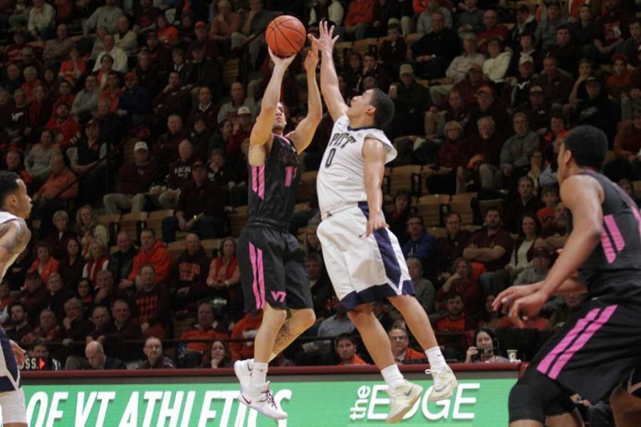 James Robinson (0) jumps for the ball at Cassell Coliseum on March 2, 2016 (Courtesy of  Cat Piper / Collegiate Times). 
