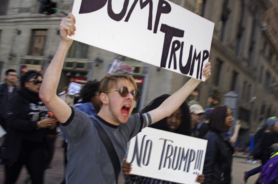 A protestor screams during the march. John Hamilton | Staff Photographer 