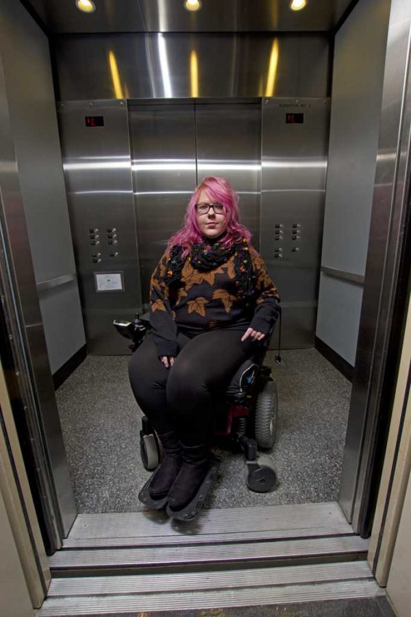 Monica Silny, in the elevator she uses to get to her dorm from the Petersen Events Center. Theo Schwarz | Senior Staff Photographer