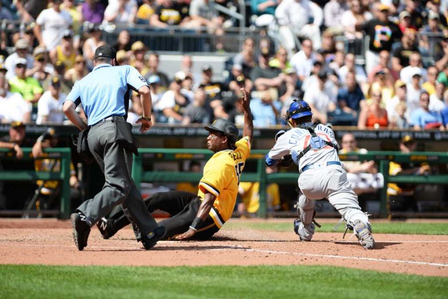 Rookie first baseman Josh Bell slides safely into home plate on Sunday afternoon. Matt Hawley | Staff Photographer 