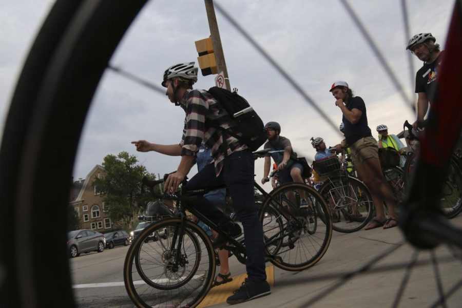 Mike Carrol from Wilkinsburg directs a pack of cyclists riding in protest of PennDOT following the death of Susan Hicks on August 1, 2016. Theo Schwarz | Senior Staff Photographer.