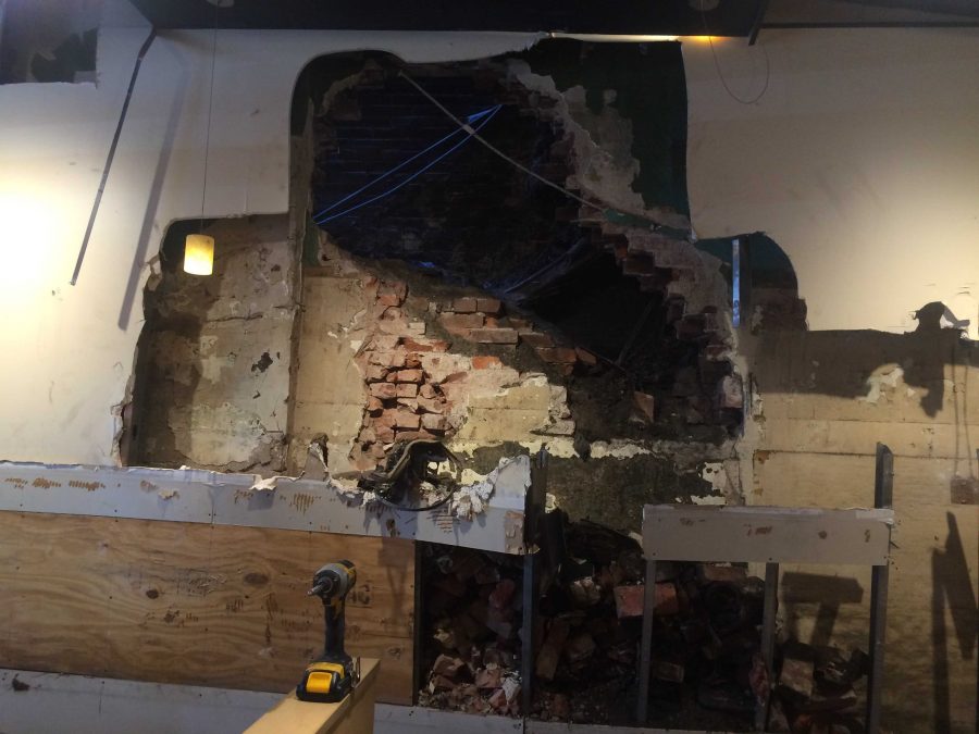 Police and fire crews had to drill a large hole in the wall of the Qdoba on Forbes Avenue in Oakland to rescue a Pitt student who was trapped between that wall the adjacent building. Photo: Lauren Rosenbaltt | News Editor
