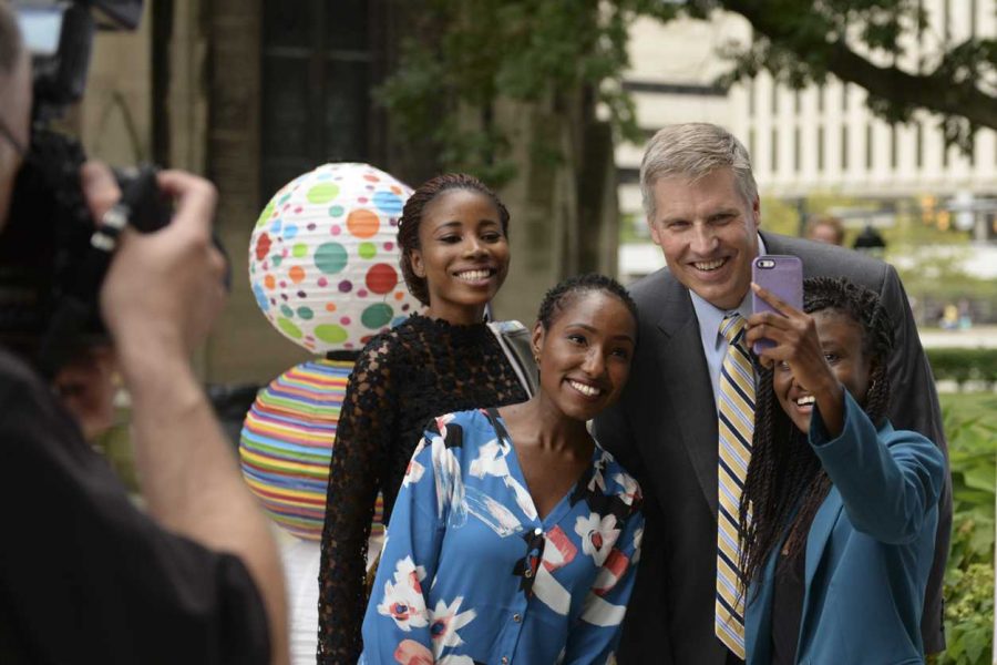 Chancellor Patrick Gallagher took selfies with international students after a reception Wednesday afternoon. Wenhao Wu / Senior Staff Photographer.