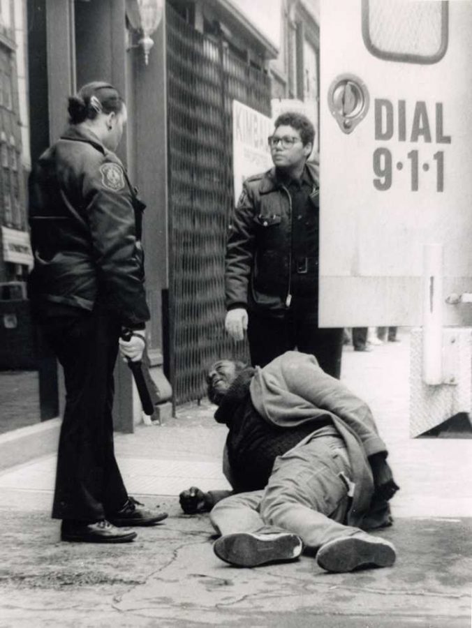 Pittsburgh Police stand over a civilian on the sidewalk | Pitt News File Photo