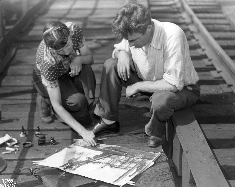 Artists pore over a sketch of the Carrie Furnaces. Courtesy of University Library Systems