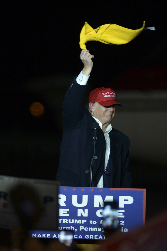 Republican Presidential candidate Donald Trump waves a Terrible Towel after landing at the Atlantic Avation hanger at the Pittsburgh airport. John Hamilton | Senior Staff Photographer