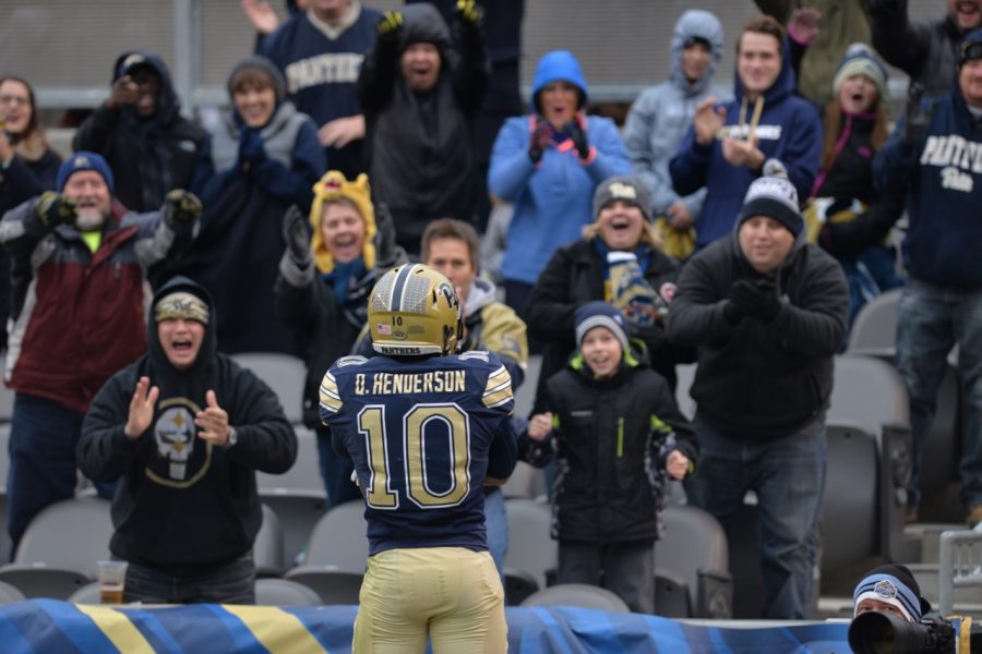 Quadree Henderson is greeted in the end zone by Pitt fans after a 66-yard touchdown run in the second half of Pitt's win. Steve Rotstein | Contributing Editor