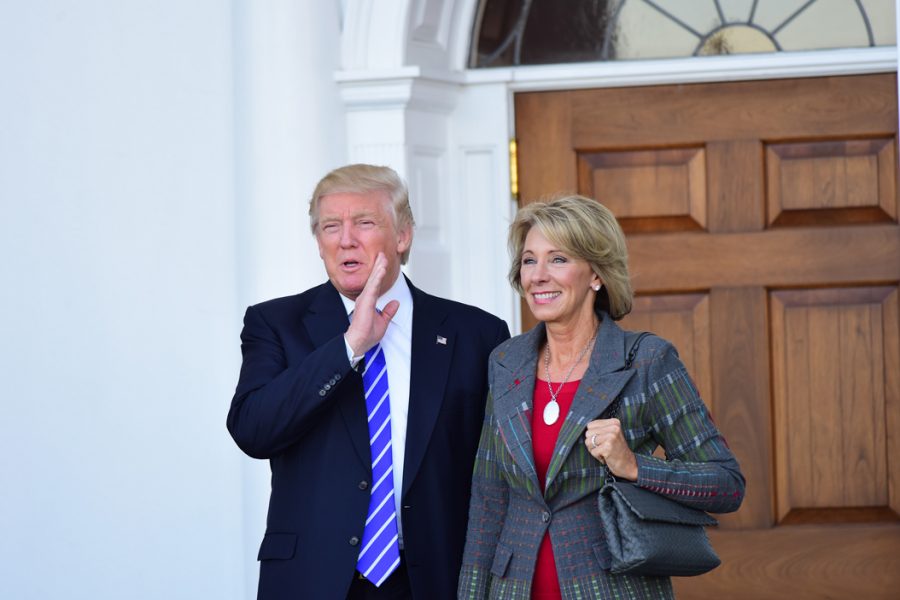 President-elect Donald Trump with Betsy DeVos, whom Trump has chosen as his secretary of education. TNS