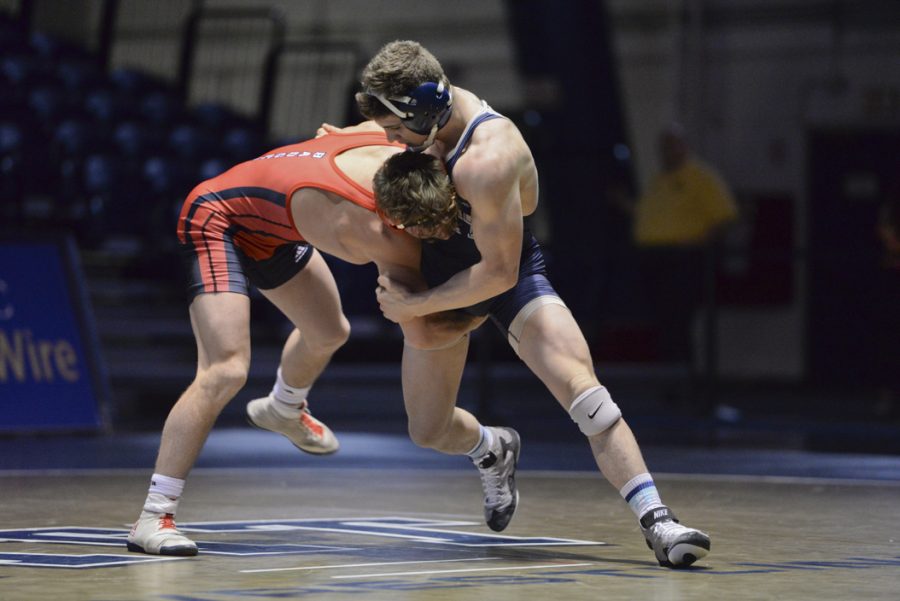 Dom Forys, along with wrestlers Jake Wentzel and TeShan Campbell, won two matches at the season opening tournament this weekend. Meghan Sunners | Senior Staff Photographer