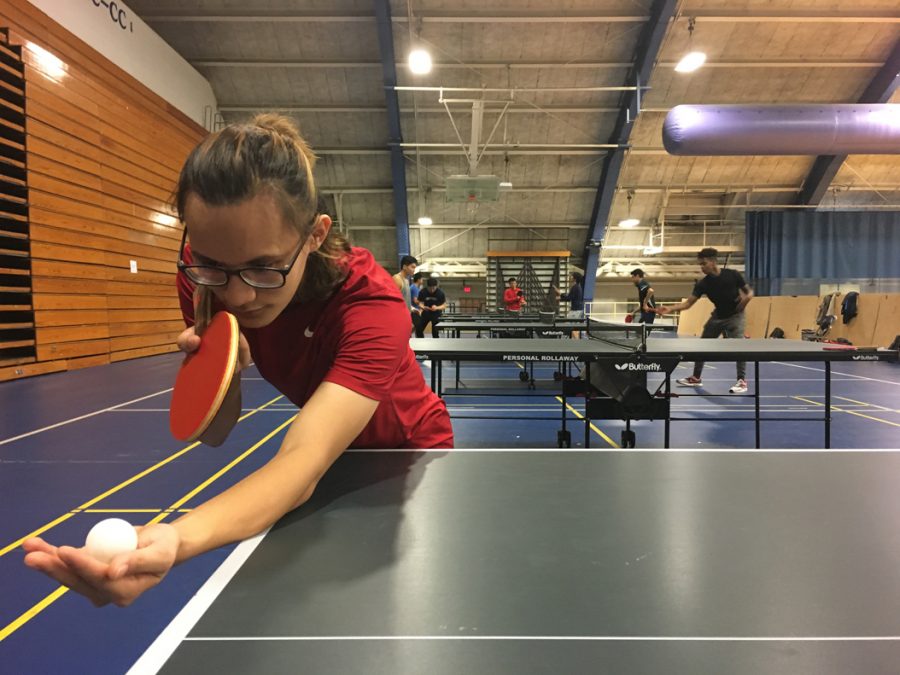 Pitt sophomore Thai Nguyen, vice president of the Pitt Ping Pong Club, lines up one of his signature curve shots. Brady Langmann | Contributing Editor