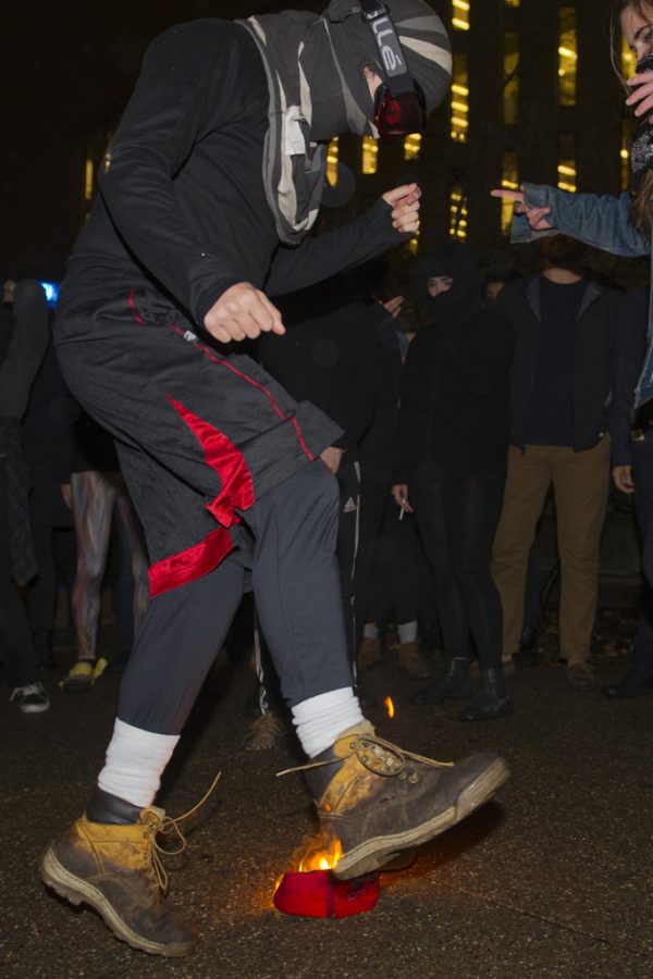 A protester stomps on a “Make America Great Again” hat during a Nov. 8 protest against the election of Donald Trump as President of the United States. John Hamilton | Senior Staff Photographer