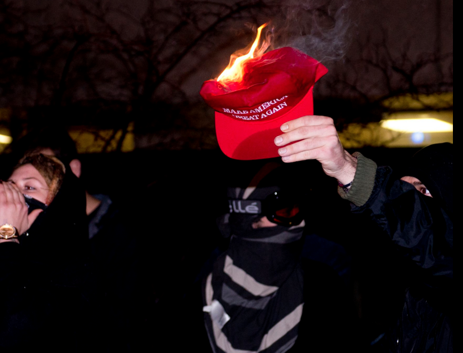 One protester burned a "Make America Great Again" shortly after Trump won the election. John Hamilton | Staff Photographer