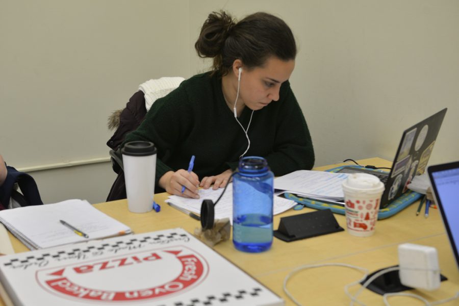 Camilla Cook, a senior in environmental studies, ordered a pizza while studying in the Hillman Library Sunday. Kyleen Considine | Staff Photographer
