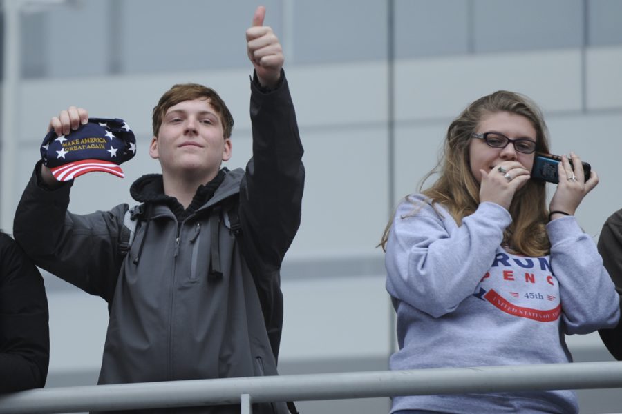 Trump supporters gesture to the marchers as they pass by Newseum. John Hamilton | Visual Editor