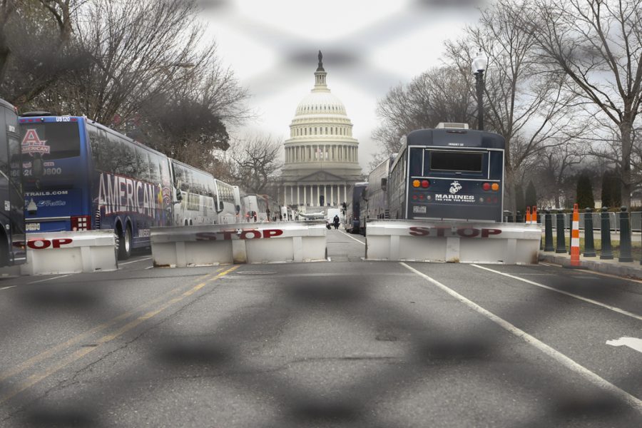 The Capitol Building is seen through a fence. John Hamilton | Visual Editor