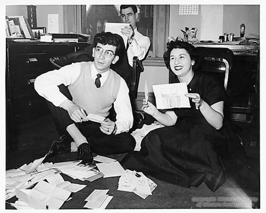 Fred Rogers (back), Henry Massucci (left) and Josie Carey open fan mail for 