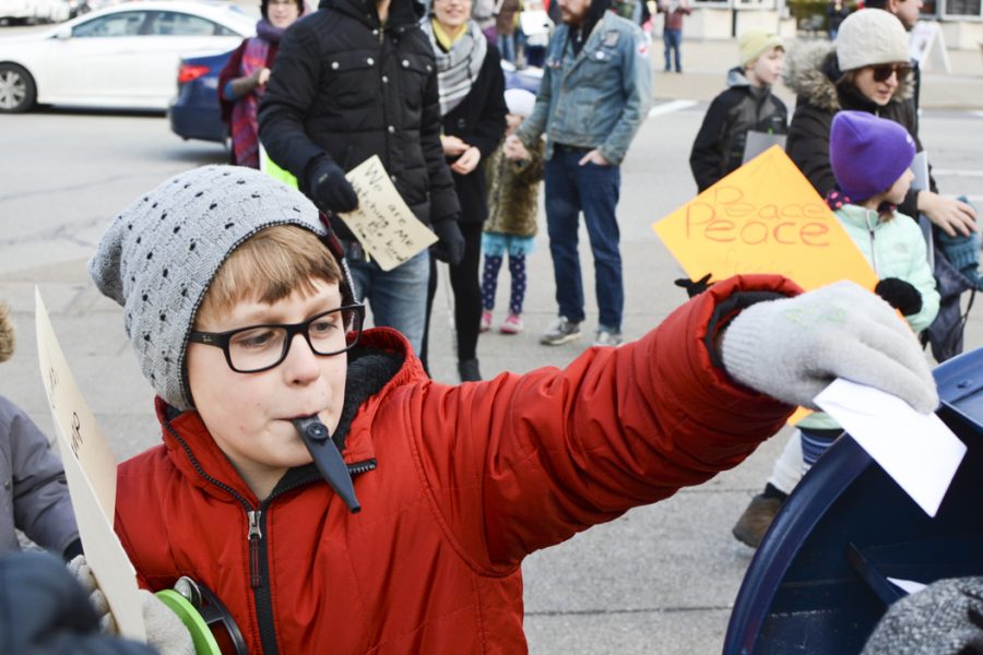 Henry Wagler, 9, puts a letter to President-elect Donald Trump into a mailbox at the corner of Forbes and Bigelow during the Pittsburgh Children's March for Peace and Kindess Sunday in Schenley Plaza. Stephen Caruso | Online Visual Editor