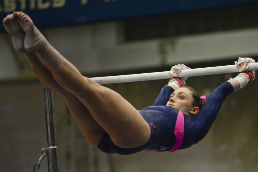 Sophomore Lucy Brett scored a 9.8 on the uneven bars Friday night in a loss to UNC. Anna Bongardino | Staff Photographer