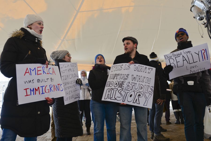 Pittsburghers braved the cold to attend the Academics United demonstration to show support for citizens affected by President Trumps immigration ban. Elaina Zachos | Senior Staff Photographer