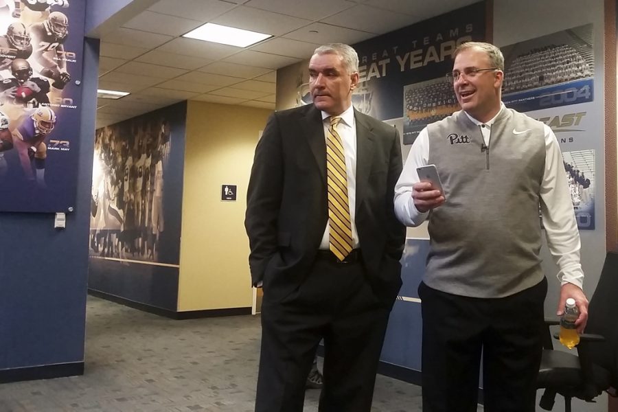 Pitt head coach Pat Narduzzi and Julio Freire, Pitts deputy athletic director for external affairs, take a moment during National Signing Day to converse with reporters. Steve Rotstein | Contributing Editor