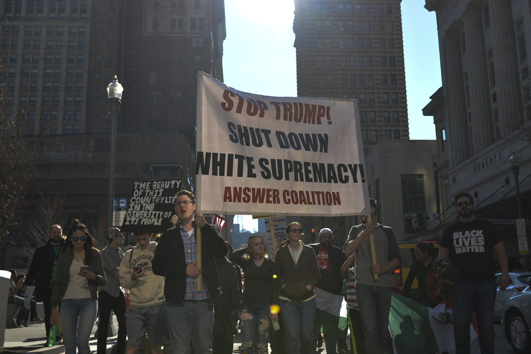 Pittsburghers marched through downtown on Sunday to protest President Donald Trump's administration. Stephen Caruso | Online Visual Editor