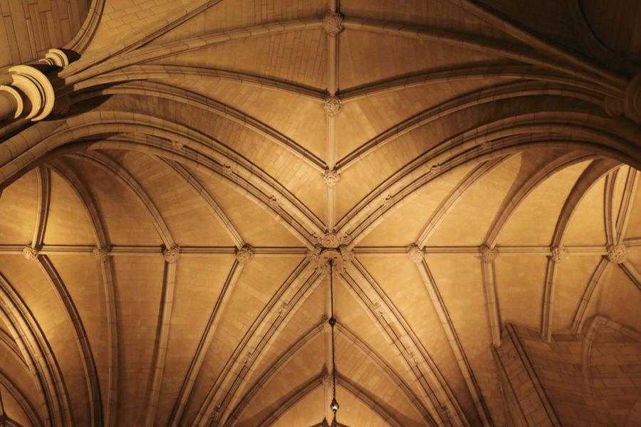 Warm lighting illuminates the ceiling of the Cathedral of Learning. John Hamilton | Visual Editor