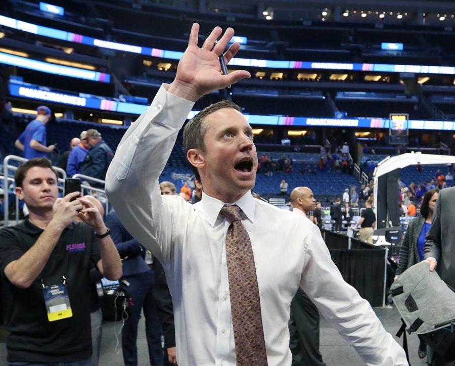 Florida head coach Mike White cheers as he leaves the court after an 80-65 win against East Tennessee State in the first round of the NCAA Tournament on Thursday, March 16, 2017, at the Amway Center in Orlando, Fla. (Stephen M. Dowell/Orlando Sentinel/TNS)