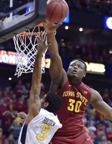 Iowa State's Deonte Burton, right, swats a shot by West Virginia's James Bolden out of the air during the second half in the Big 12 Tournament final at Sprint Center in Kansas City, Missouri, on Saturday, March 11, 2017. Iowa State won, 80-74. (Rich Sugg/Kansas City Star/TNS)