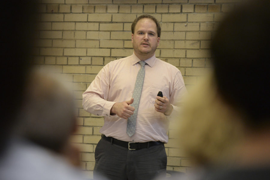 Justin Miller, an employee of the Pittsburgh Department of City Planning, speaks to Oakland residents Monday about preferred BRT routes. (Photo by Anna Bongardino | Visual Editor)