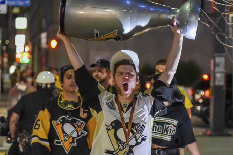 A Penguins fan celebrates after the teams Stanley Cup repeat Sunday. (Photo by Matt Hawley/Senior Staff Photographer)