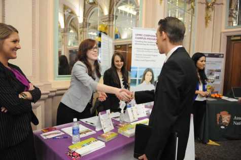 Pitt students network with UPMC recruiters at the 2014 Spring Career Fair.  (TPN File Photo)