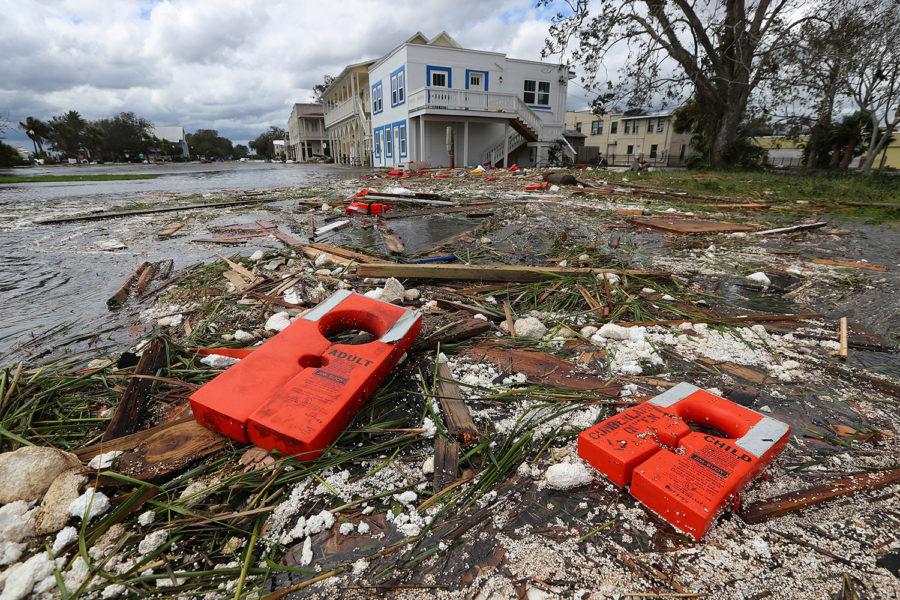 Life jackets for an adult and a child from the remains of the old Cumberland Queen Ferry, which sank, are part of the debris littering the flooded main street after Hurricane Irma swept through the area on Monday, Sept. 11, 2017, in St. Marys, Ga. (Curtis Compton/Atlanta Journal-Constitution/TNS)