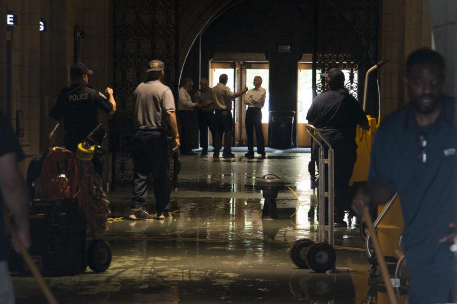 Workers begin to clean up the Cathedral of Learning after a water main broke on the third floor Monday morning. (Photo by John Hamilton / Managing Editor)