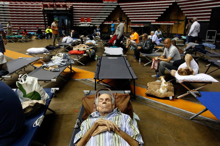 Hundreds of San Juan residents have taken shelter at the Roberto Clemente Coliseum in San Juan, Puerto Rico, on Tuesday, Sept. 19, 2017, until Hurricane Maria passes. (Carolyn Cole/Los Angeles Times/TNS)