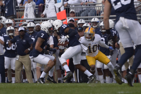Quadree Henderson tries to make a tackle after Penn State intercepted a pass.
(Photo by Wenhao Wu)
